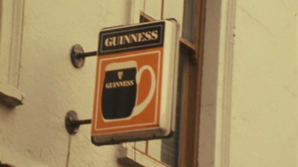A sign with a Guinness logo