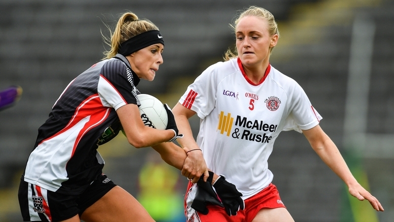 Neamh Woods (R) keeps an eye on Sarah Reynolds of Sligo.