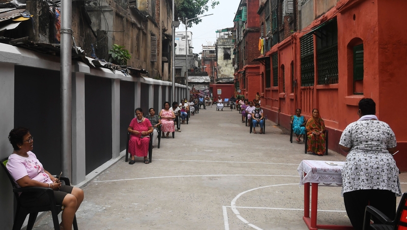 People maintain social distancing during Good Friday prayers in Kolkata