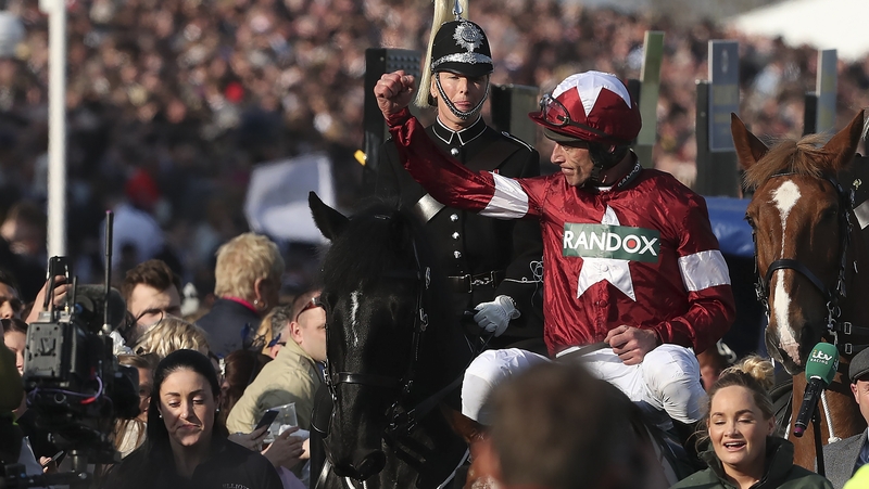 Jockey Davy Russell celebrates after riding Tiger Roll to Grand National victory in 2018