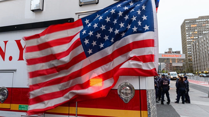 A view of the US flag mounted on an ambulance outside a hospital in New York