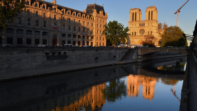 The Notre-Dame Cathedral at sunset during the ring of the Bourdon bell on the first anniversary of the fire