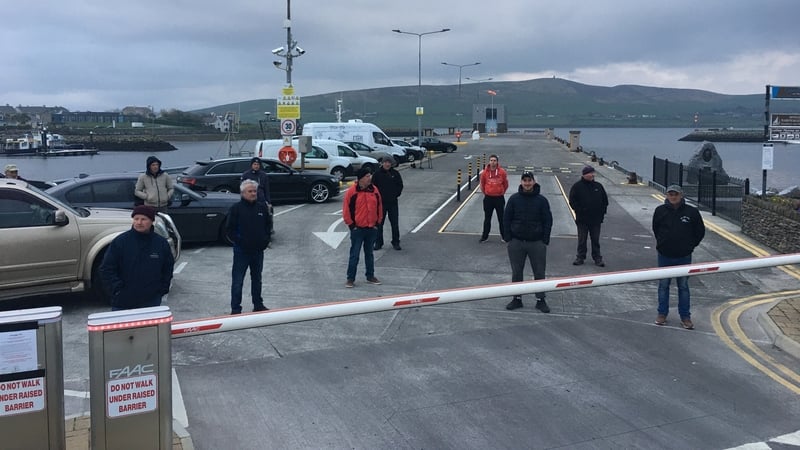 The fishermen are attempting to stop a Spanish trawler from landing fish