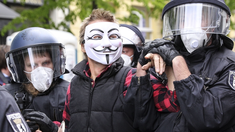 German police remove protester during Berlin demonstration