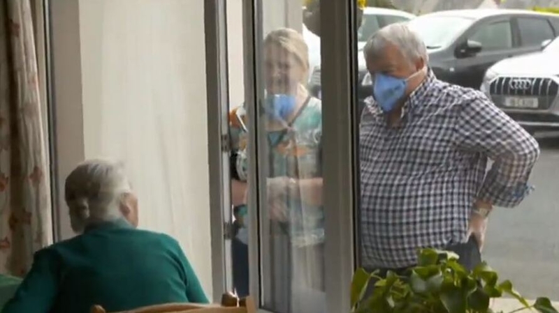 Visitors looking through the windows of Abbot Close care home in Askeaton