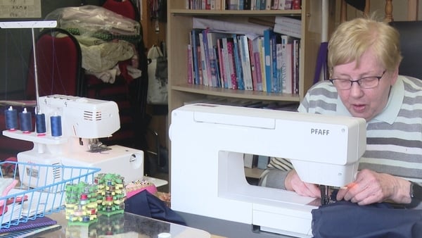 ICA president Josephine Helly prepares a tunic at her home