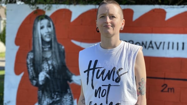 Dublin artist Emmalene Blake in front of her Cardi B mural