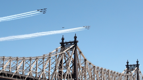 US Navy's Blue Angels and the Air Force Thunderbirds fly over Ed Koch Queensboro Bridge in New York in a tribute to frontline responders