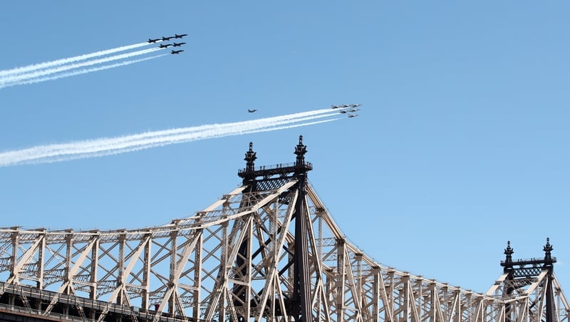 US Navy's Blue Angels and the Air Force Thunderbirds fly over Ed Koch Queensboro Bridge in New York in a tribute to frontline responders