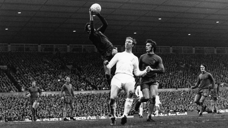 Chelsea goalkeeper Peter Bonetti leaps high to grab the ball from Jack Charlton