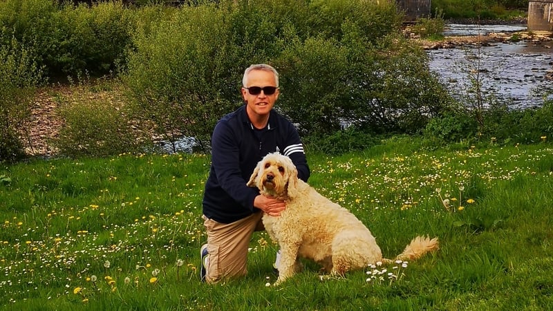 Joe Stack with his dog Mossie on the bank of the river Feale in Listowel.