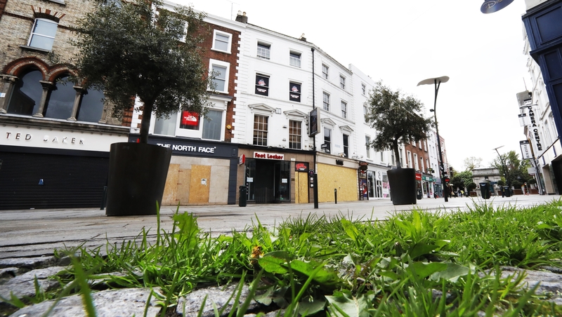 Grass grows through the cobbles of the normally teeming Grafton Street