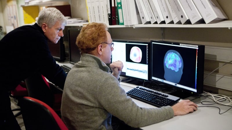 Researchers at the Pitie Salpetriere hospital in Paris, France using the Magnetoencephalography (MEG) platform to detch variations in the brain's magnetic field during various types of activity. Photo: BSIP/Universal Images Group via Getty Images