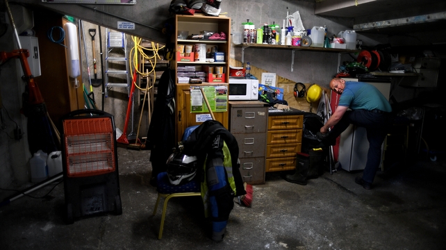 Thurles groundsman Dave Hanley ties his boot laces before doing a check around the property on the evening of the Munster GAA Football Senior Championship quarter-final match between Tipperary and Clare at Semple Stadium