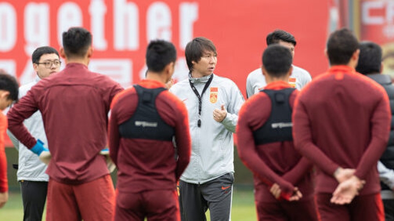 Coach Li Tie with his squad