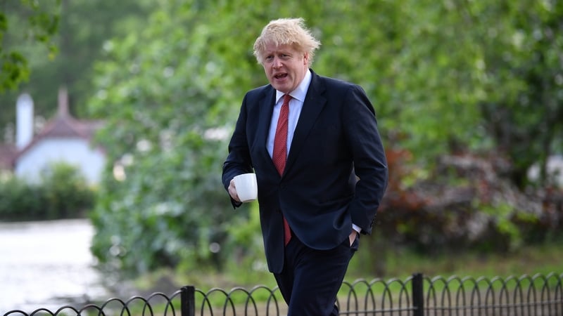 British Prime Minister Boris Johnson walking in St James' Park in London today
