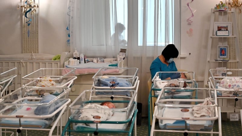 A nurse cares for newborn babies at Kiev's Venice hotel