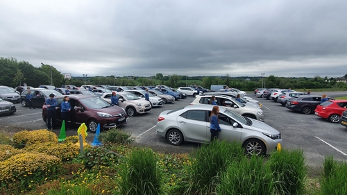 77 students from Beech Hill College arrived in cars with their families for the ceremony