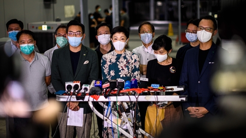 Pro-democracy politicians speak to the media after China's parliament said it will discuss a proposal for a national security law