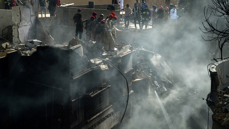 The plane was close to landing when it came down among houses