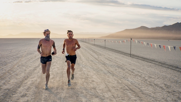 Ciarán Ó Lionáird (left) running with a face mask in the Nevada desert at Burning Man (Photo credit: John Jefferson - Instagram: jjeffersoniv)