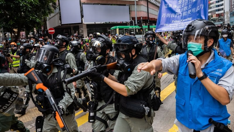 Riot police on the streets as thousands rally over proposed security laws