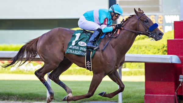 Charlatan winning the Arkansas Derby earlier this month