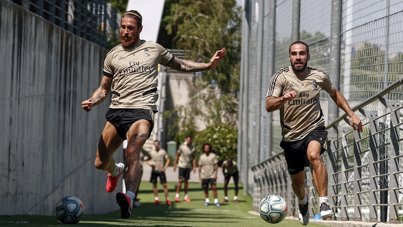 Real Madrid's Sergio Ramos (L) and Dani Carvajal are put through their paces in training