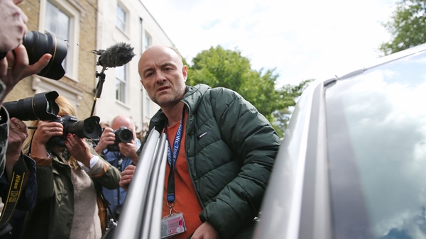 Dominic Cummings is flanked by photographers as he gets into his car outside his home earlier this week