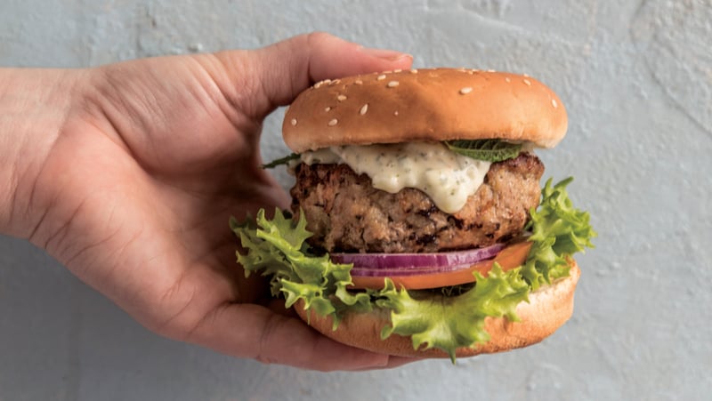 Lamb burgers with tzatziki and an olive and red pepper rocket salad