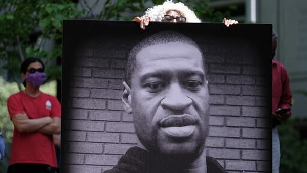 George Floyd died after being pinned down with a knee to the throat by a police officer for nearly nine minutes