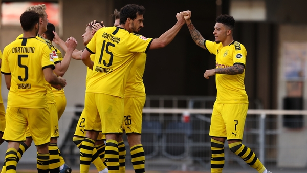 Jadon Sancho celebrates scoring his teams third goal of the game