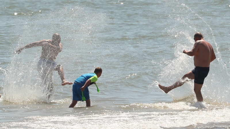 People splash in the sea at Brittas Bay in Co Wicklow