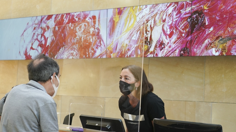 A man buys his ticket on the day the Guggenheim Museum in Bilbao reopens its facilities after the coronavirus shutdown