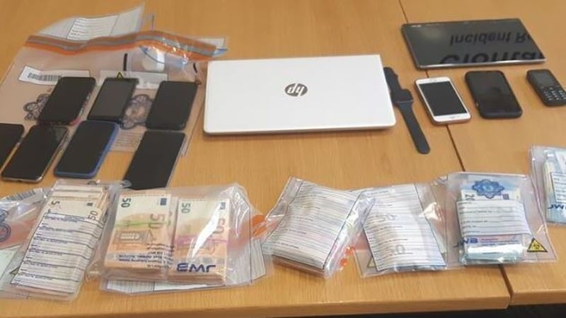 Cash and phones were among the items seized during the searches in Dublin