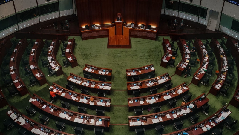 Less seats in Hong Kong's legislature will be directly elected and anyone standing for election will also have to be vetted for their political views