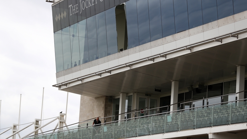 Workmen clear up after a window fell out of the Champions Gallery