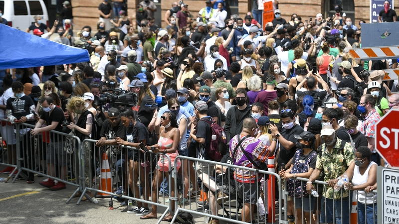 Mourners gather outside the Trask Worship Center while a memorial service for George Floyd takes place inside