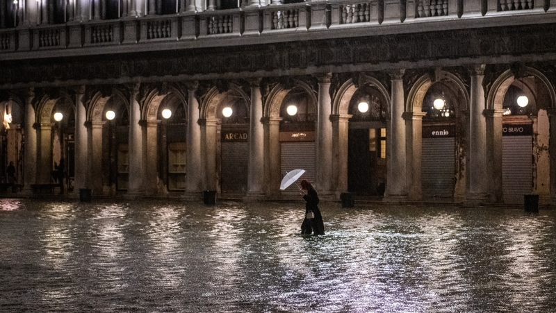 A pedestrian crosses St Mark's Square on Thursday night