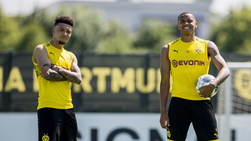 Jadon Sancho (L) and Manuel Akanji (R)
