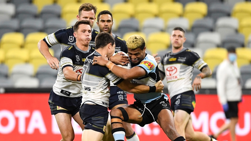 Ronaldo Mulitalo of the Sharks in action against North Queensland