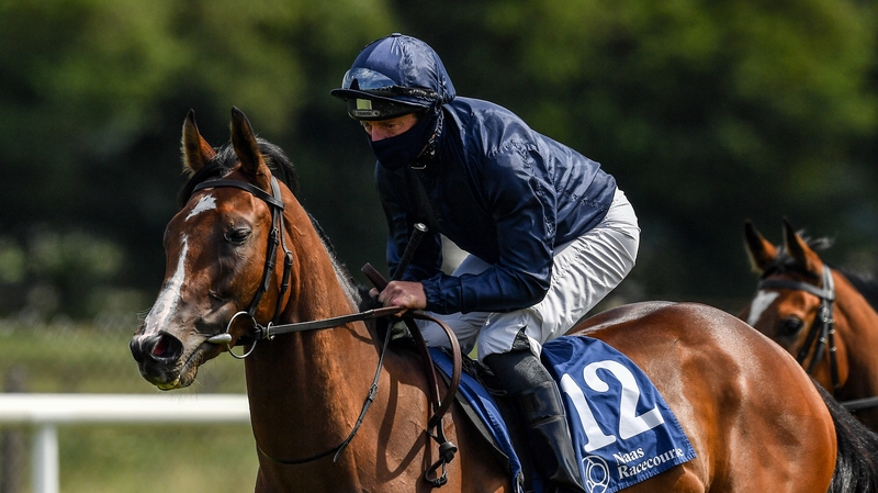 Jockey Seamie Heffernan, wearing a protective mask, on eventual winner More Beautiful