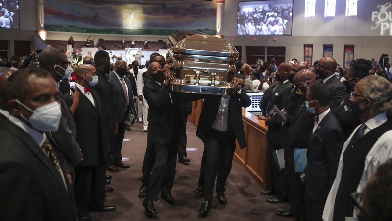 Pallbearers carrying the casket of George Floyd out of the Fountain of Praise Church following the funeral