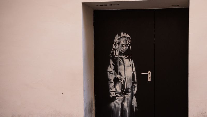 The artwork by street artist Banksy on a side street to the Bataclan concert hall in June 2018