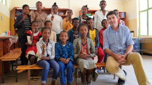 Fr Stephen Monaghan with some of the children who attend the school in Ambo