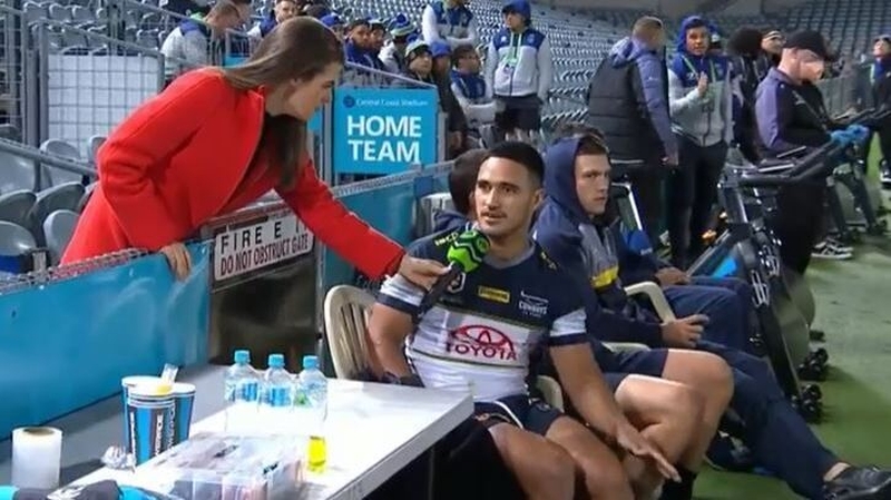 Fox Sports reporter Hannah Hollis (L) conducting a sideline interview with Cowboys star Valentine Holmes