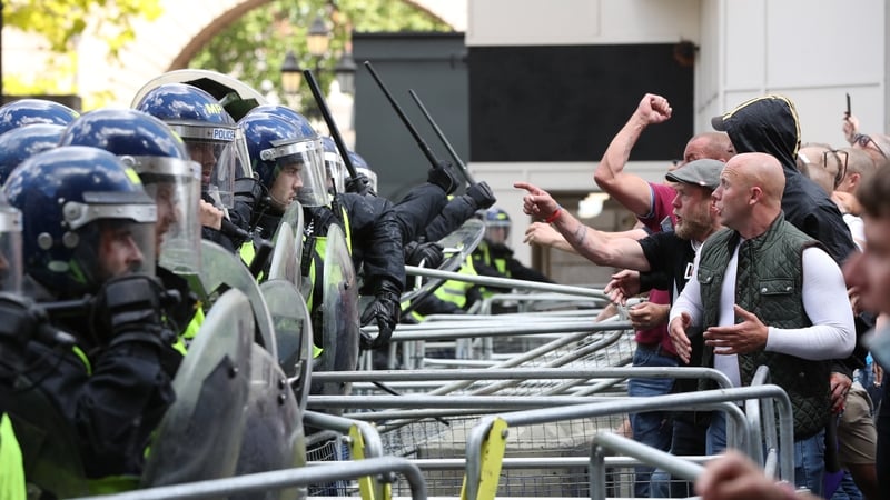 Activists argue with police near Parliament Square in London