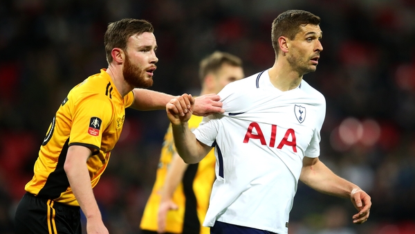 Mark O'Brien (L) marks Fernando Llorente of Tottenham Hotspur in 2018