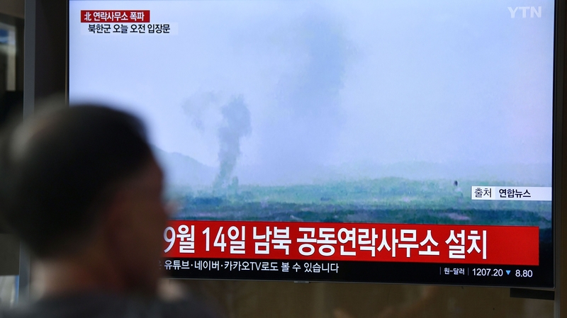 People in South Korea watch footage of the explosion at an inter-Korean liaison office in Kaesong, North Korea