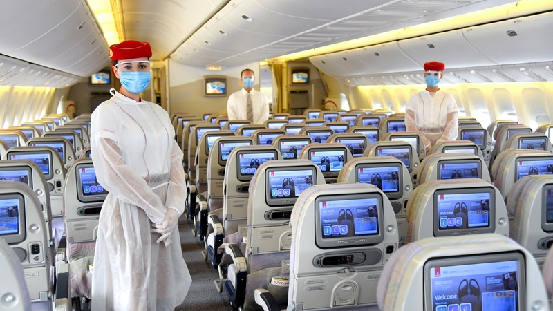 Emirates cabin crew are wearing PPE on flights